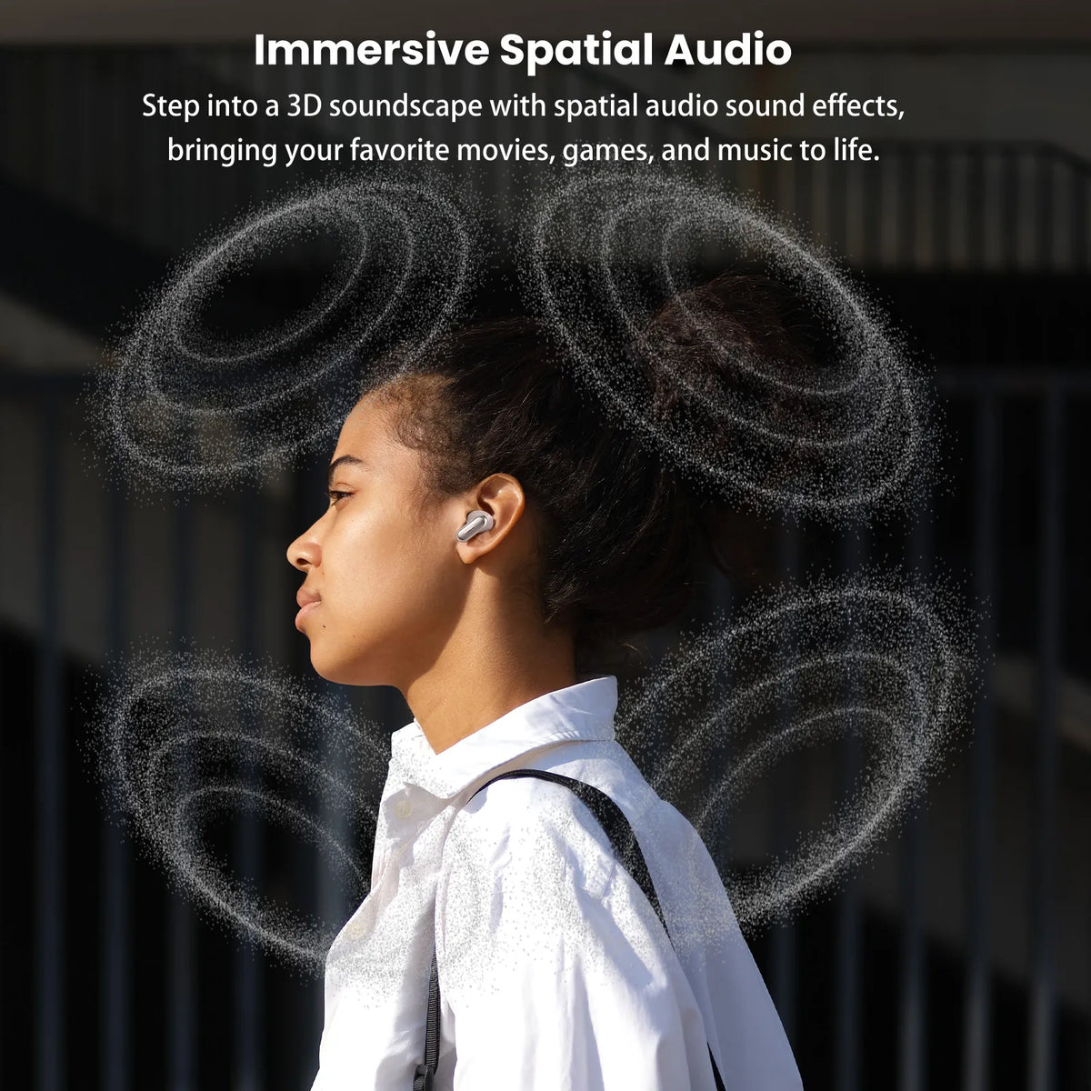Person wearing wireless earbuds with text about immersive spatial audio