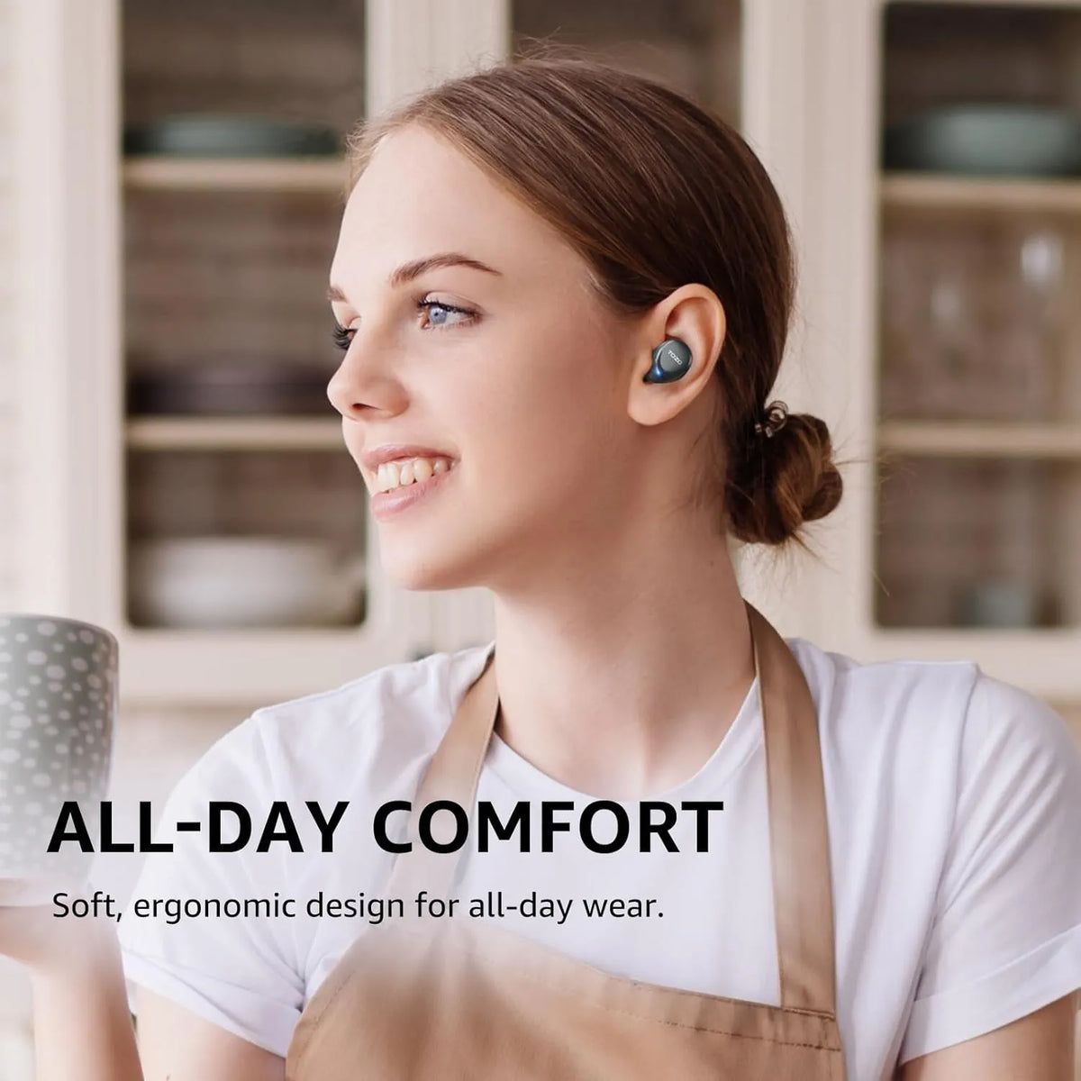 Woman wearing wireless earbuds with text 'All-Day Comfort' in a kitchen setting