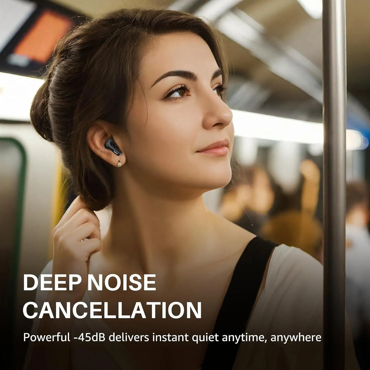 Woman wearing wireless earbuds on a train with text about deep noise cancellation.