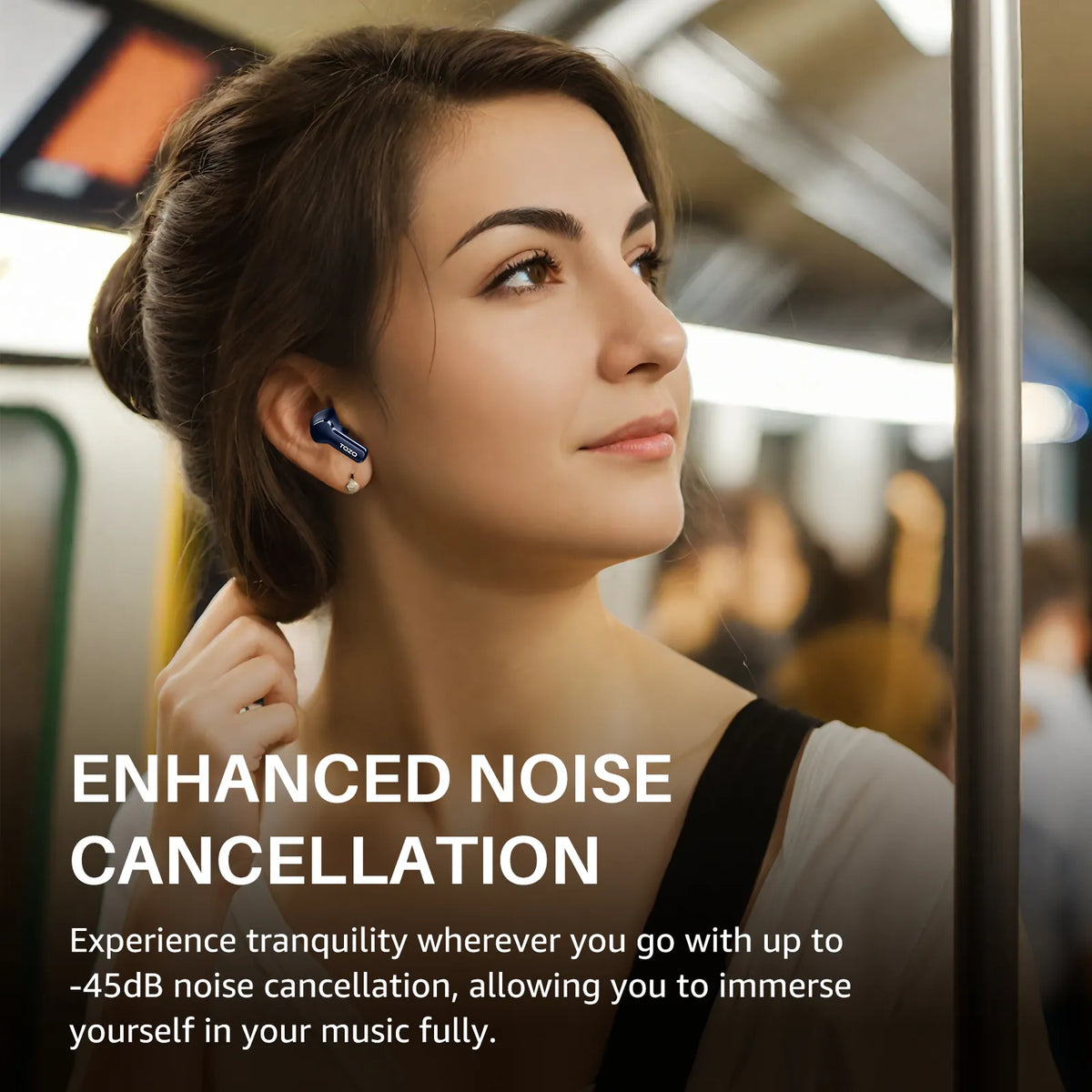 Woman using earbuds with text about enhanced noise cancellation on a subway.