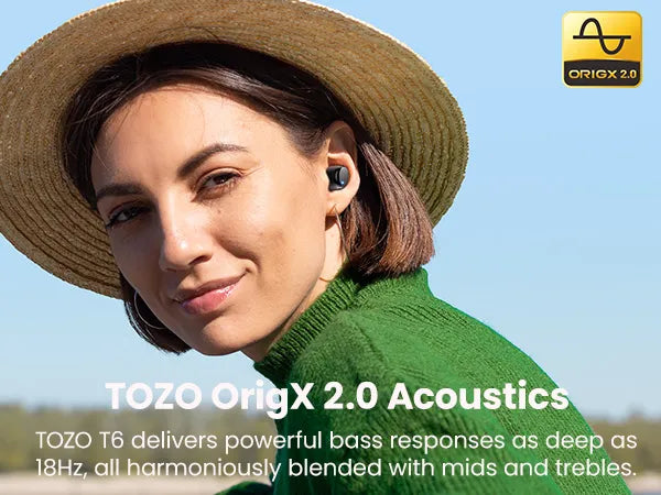 Woman wearing a straw hat and green sweater with TOZO Acoustics branding.