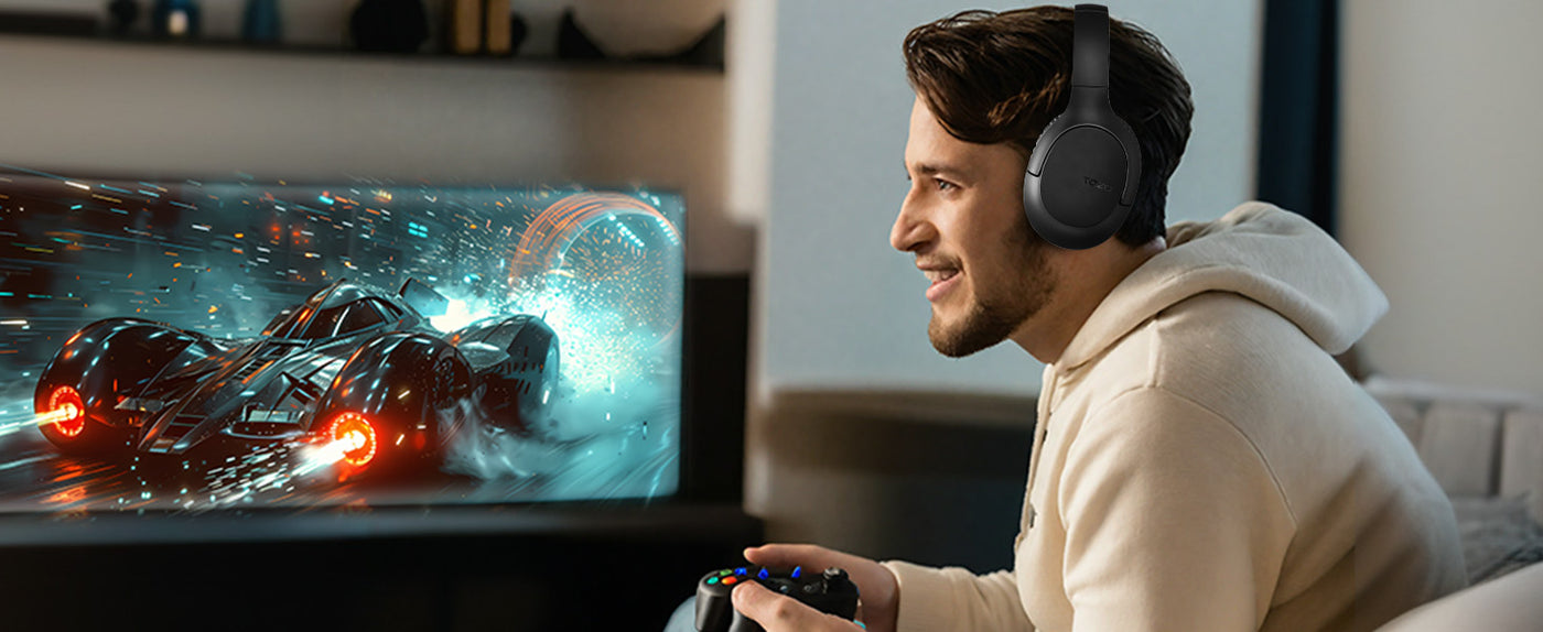 Man gaming with TOZO H100 wireless headphones